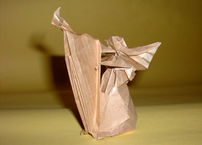 Origami Angel playing the harp by Fumiaki Kawahata. Folded from a square of thin wrapping paper by Gilad Aharoni on giladorigami.com