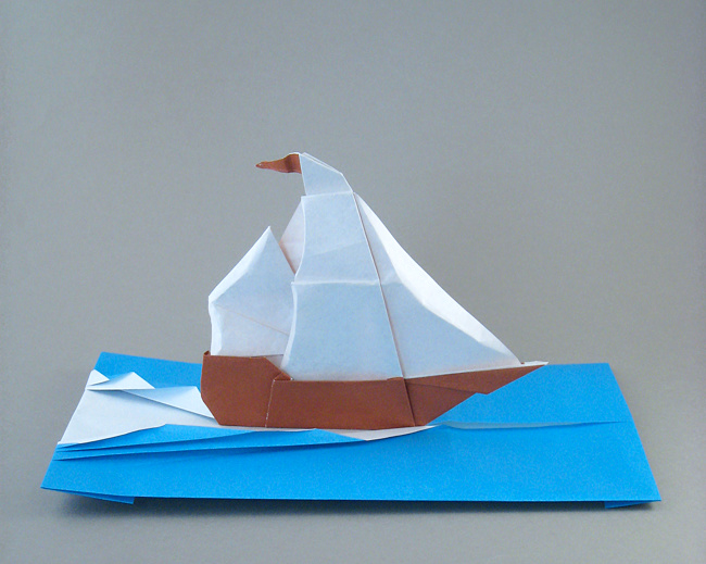 Origami Sailing ship and waves by Francesco Miglionico. Folded from 2 squares of origami paper by Gilad Aharoni on giladorigami.com