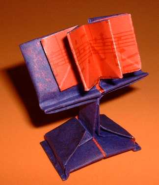 Origami Bookrest with a book by Ichiro Kinoshita. Folded by Gilad Aharoni on giladorigami.com