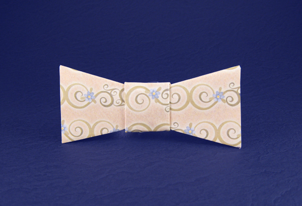 Origami Child's bow tie by John Montroll. Folded from a square of scrapbooking paper by Gilad Aharoni on giladorigami.com