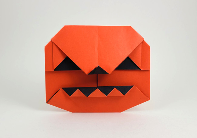 Origami Jack-o'-lantern by Wayne Brown. Folded from a square of Duo origami paper by Gilad Aharoni on giladorigami.com