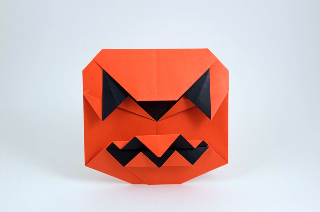 Origami Jack-o'-lantern by Wayne Brown. Folded from a square of Duo origami paper by Gilad Aharoni on giladorigami.com