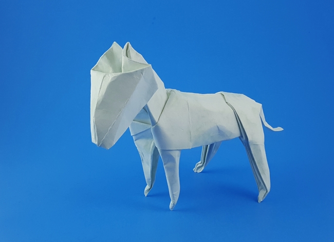 Origami Bull terrier by John Montroll. Folded from a square of Royal Marble scrapbooking paper by Gilad Aharoni on giladorigami.com