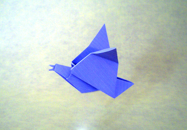 Origami Calling bird by John Montroll. Folded from a square of Kraft origami paper by Gilad Aharoni on giladorigami.com