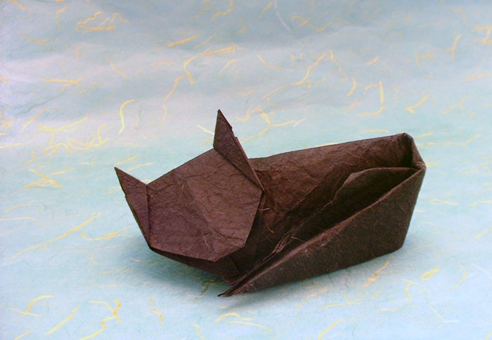 Origami Cat - sleeping by Jeremy Shafer. Folded from a $ proportioned rectangle of Vietnamese wrapping-paper by Gilad Aharoni on giladorigami.com