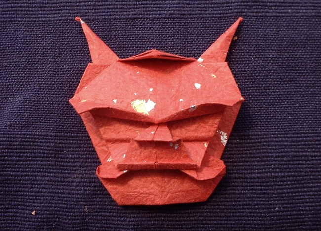 Origami Demon mask by Akira Yoshizawa. Folded from a square of momigami by Gilad Aharoni on giladorigami.com