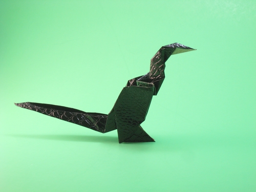 Origami Baby dinosaur by Michael G. LaFosse. Folded from a square of textured origami paper by Gilad Aharoni on giladorigami.com