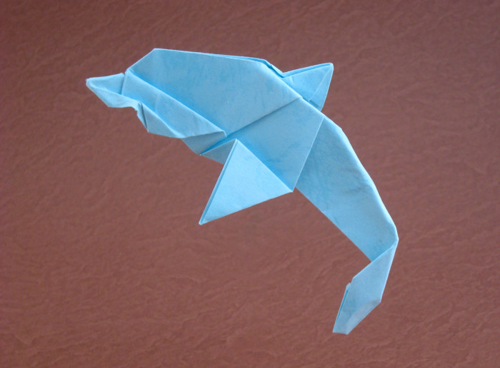 Origami Dolphin by Kunihiko Kasahara. Folded from a square of textured origami paper by Gilad Aharoni on giladorigami.com