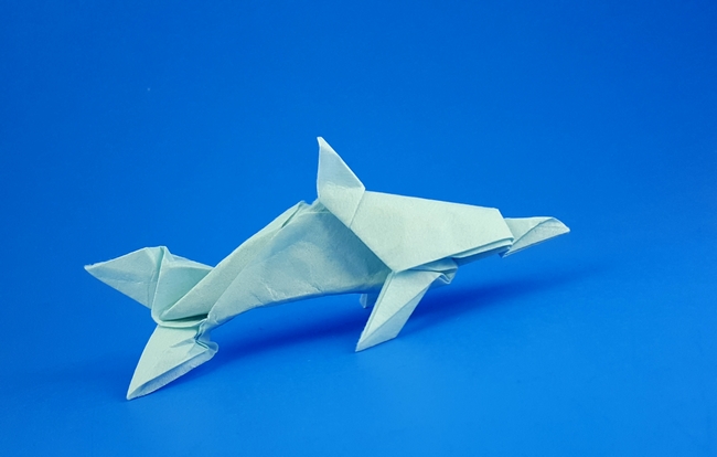 Origami Dolphin by John Montroll. Folded from a square of Korean Hanji by Gilad Aharoni on giladorigami.com