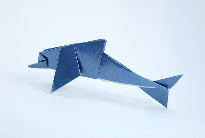 Origami Dolphin by Nick Robinson. Folded from a square of metallic origami paper by Gilad Aharoni on giladorigami.com