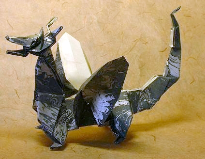 Origami Dragon - Western by John Montroll. Folded from a square of decorated paper by Gilad Aharoni on giladorigami.com