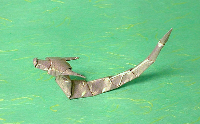 Origami Eastern dragon by Akira Yoshizawa. Wet-folded from a square of India Gold scrapbooking paper by Gilad Aharoni on giladorigami.com