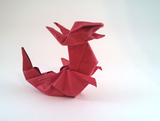 Origami Dragon by Jozsef Zsebe. Wet-folded from a square of textured origami paper by Gilad Aharoni on giladorigami.com
