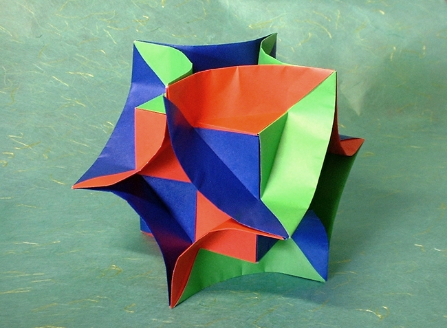Origami Enigma cube by David Brill. Folded from 12 squares of origami paper by Gilad Aharoni on giladorigami.com