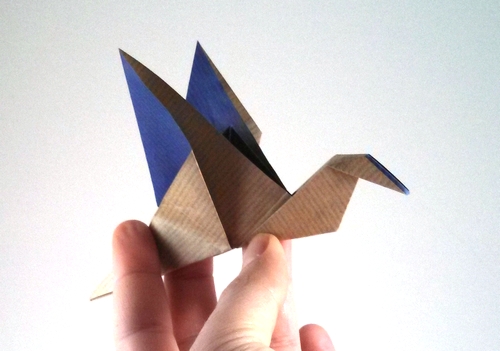 Origami Flapping bird by Paul Jackson. Folded from a square of Kraft origami paper by Gilad Aharoni on giladorigami.com