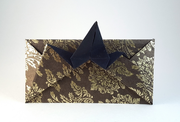 Origami Flapping bird card wrapper by Michael G. LaFosse. Folded from a square of hand-made paper by Gilad Aharoni on giladorigami.com