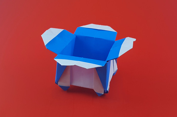 Origami Flower box with legs by Miyuki Kawamura. Folded from a square of origami paper by Gilad Aharoni on giladorigami.com
