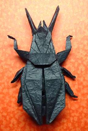 Origami Ground beetle by John Montroll. Folded from a square of Vietnamese wrapping-paper by Gilad Aharoni on giladorigami.com