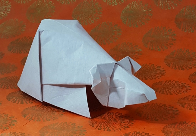 Origami Guinea pig by David Brill. Folded from a square of Astroparche crepe embossed cardstock by Gilad Aharoni on giladorigami.com