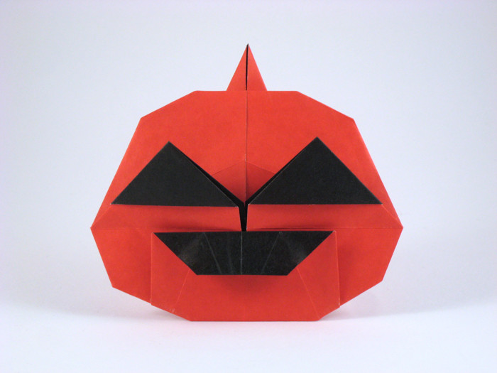 Origami Jack-o'-lantern by Niwa Taiko. Folded from a square of duo origami paper by Gilad Aharoni on giladorigami.com