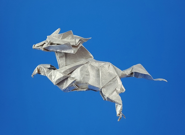 Origami Kirin - Eastern unicorn by Satoshi Kamiya. Wet-folded from a square of painted brown wrapping paper by Gilad Aharoni on giladorigami.com