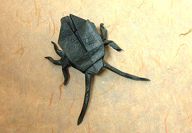 Origami Long-horned beetle by John Montroll. Folded from a square of Vietnamese wrapping-paper by Gilad Aharoni on giladorigami.com