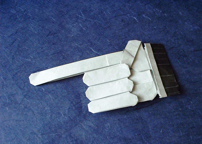Origami Look! - Pointing hand by Tomo Ogawa. Folded from a square of origami paper by Gilad Aharoni on giladorigami.com