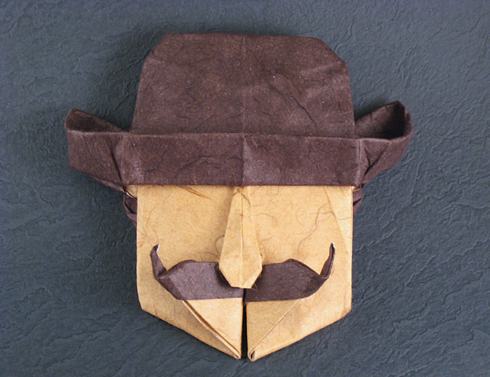 Origami Madrid man by Juan Gimeno. Wet-folded from a square of double-sided mulberry paper by Gilad Aharoni on giladorigami.com