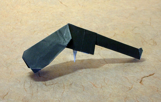 Origami Magnum gun by Makoto Yamaguchi. Folded from a square of origami paper by Gilad Aharoni on giladorigami.com