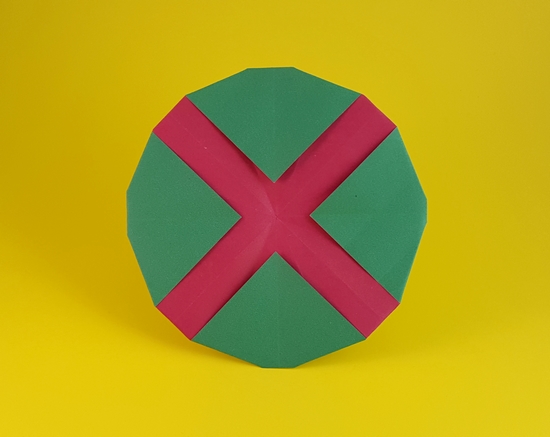 Origami Martian Manhunter symbol by John Montroll. Folded from a square of duo origami paper by Gilad Aharoni on giladorigami.com