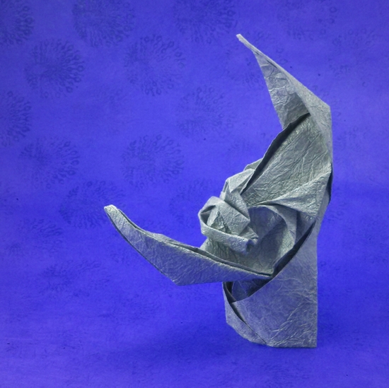 Origami Moon face by Kawai Toyoaki. Folded from a square of Crinkle Silver scrapbooking paper by Gilad Aharoni on giladorigami.com