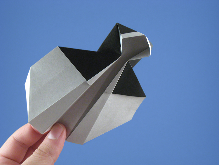 Origami Nun - flying by Stephen Weiss. Folded from a square of origami paper by Gilad Aharoni on giladorigami.com