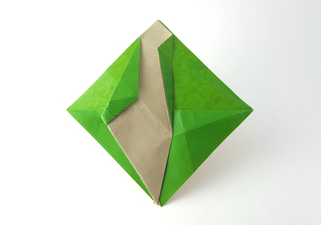 Origami OrigamIsrael logo by Shai Seger. Folded from a square of Kraft origami paper by Gilad Aharoni on giladorigami.com