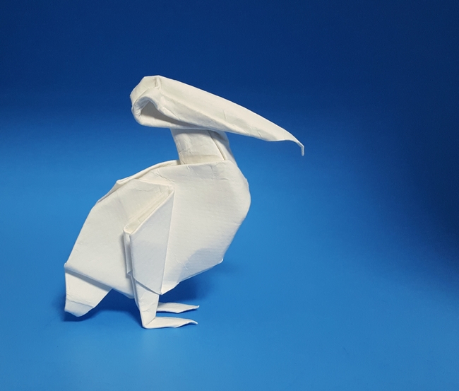 Origami Pelican by Ligia Montoya. Wet folded from a triangle of watercolor paper by Gilad Aharoni on giladorigami.com