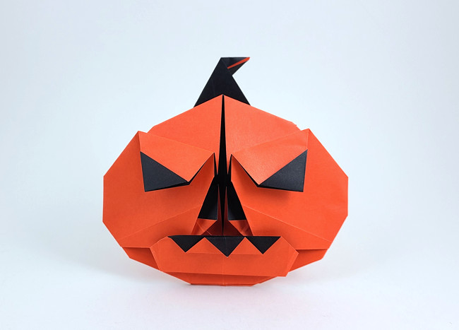 Origami Jack-o'-lantern by Quentin Trollip. Folded from a square of duo origami paper by Gilad Aharoni on giladorigami.com
