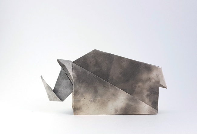 Origami Rhinoceros by Ta Trung Dong. Folded from a square of scrapbooking paper by Gilad Aharoni on giladorigami.com