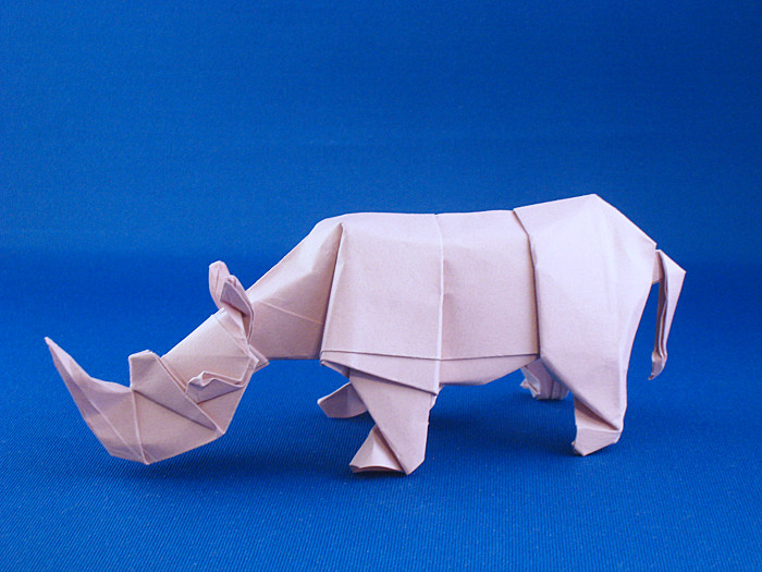 Origami Rhinoceros - white by Quentin Trollip. Folded from a square of Tant paper by Gilad Aharoni on giladorigami.com