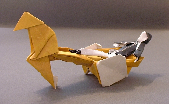 Origami Man in black and white by Neal Elias. Folded from a square of origami paper by Gilad Aharoni on giladorigami.com