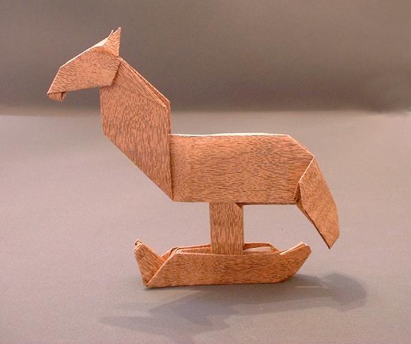 Origami Rocking horse by Alfredo Giunta. Folded from a rectangle of wood-like paper by Gilad Aharoni on giladorigami.com