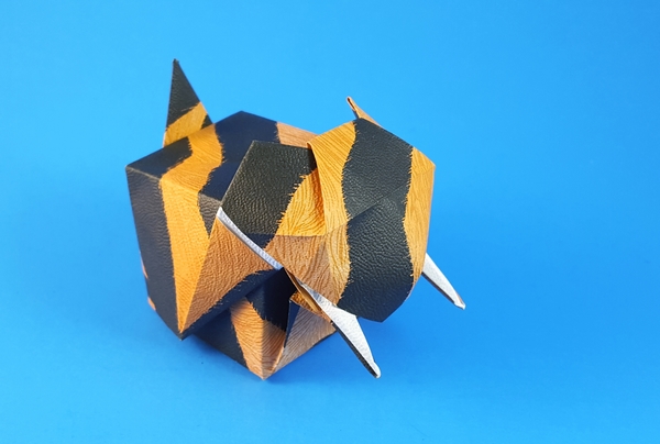 Origami Saber-tooth tiger box by Rikki Donachie. Folded from 2 squares of animal-pattern origami paper by Gilad Aharoni on giladorigami.com