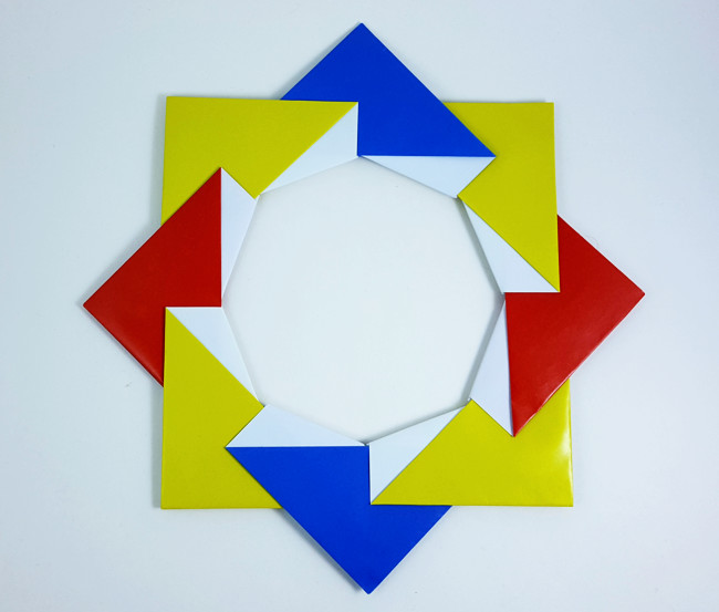 Origami Sailboat wreath by Michael G. LaFosse. Folded from 8 squares of origami paper by Gilad Aharoni on giladorigami.com