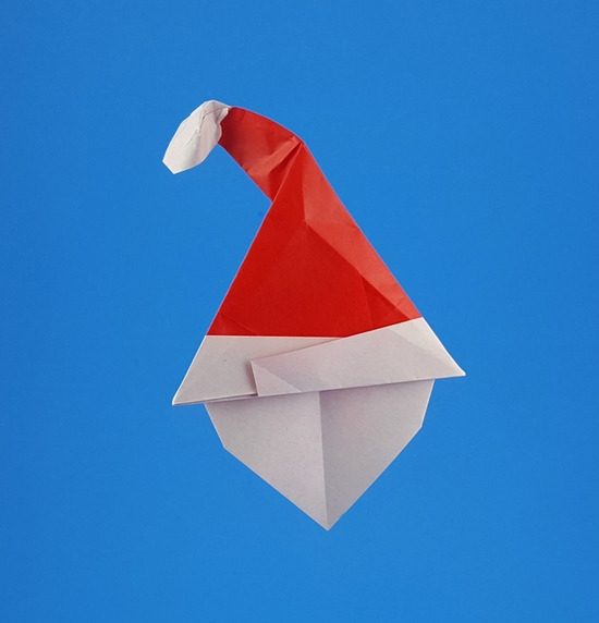 Origami Santa Claus face 2 by Alfredo Giunta. Folded from a square of origami paper by Gilad Aharoni on giladorigami.com