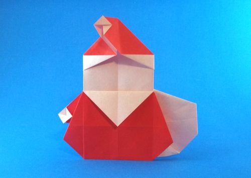 Origami Santa Claus - stout with sack by Ryo Aoki. Folded from a square of origami paper by Gilad Aharoni on giladorigami.com