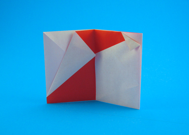 Origami Santa card by Sy Chen. Folded from a square of origami paper by Gilad Aharoni on giladorigami.com