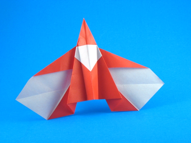 Origami Santa - flying by Sy Chen. Folded from a square of origami paper by Gilad Aharoni on giladorigami.com