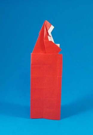 Origami Santa Claus in chimney by Robert Harbin. Folded from a rectangle of origami paper by Gilad Aharoni on giladorigami.com
