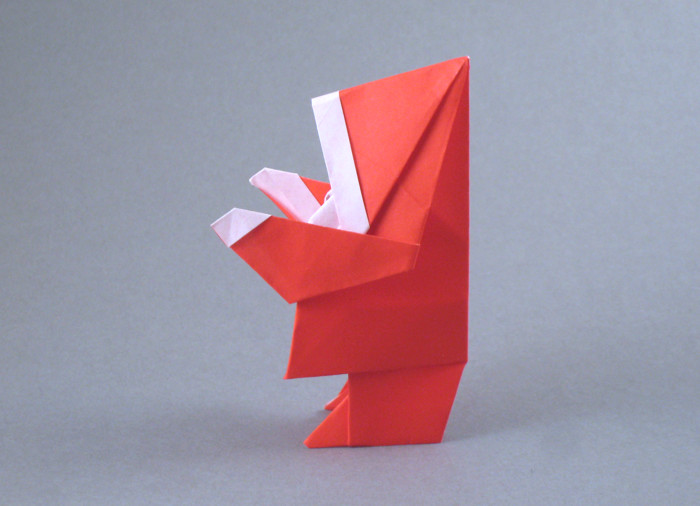 Origami Santa Claus by Edwin Corrie. Folded from a square of origami paper by Gilad Aharoni on giladorigami.com