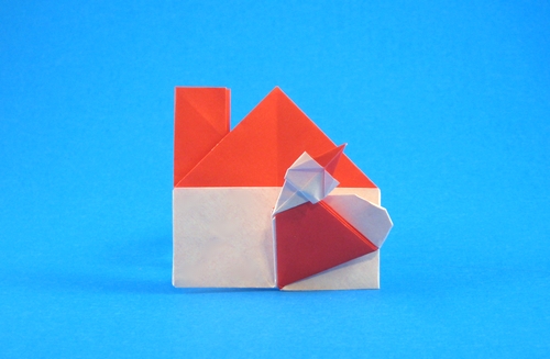 Origami Santa Claus has come to my house by Enomoto Nobuyoshi. Folded from a square of origami paper by Gilad Aharoni on giladorigami.com