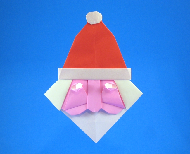Origami Santa Claus head by Alfredo Giunta. Folded from 3 squares of origami paper by Gilad Aharoni on giladorigami.com