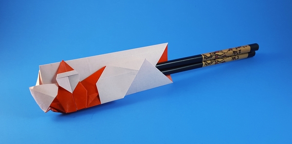 Origami Santa Claus chopsticks wrapper by Inayoshi Hidehisa. Folded from a square of origami paper by Gilad Aharoni on giladorigami.com